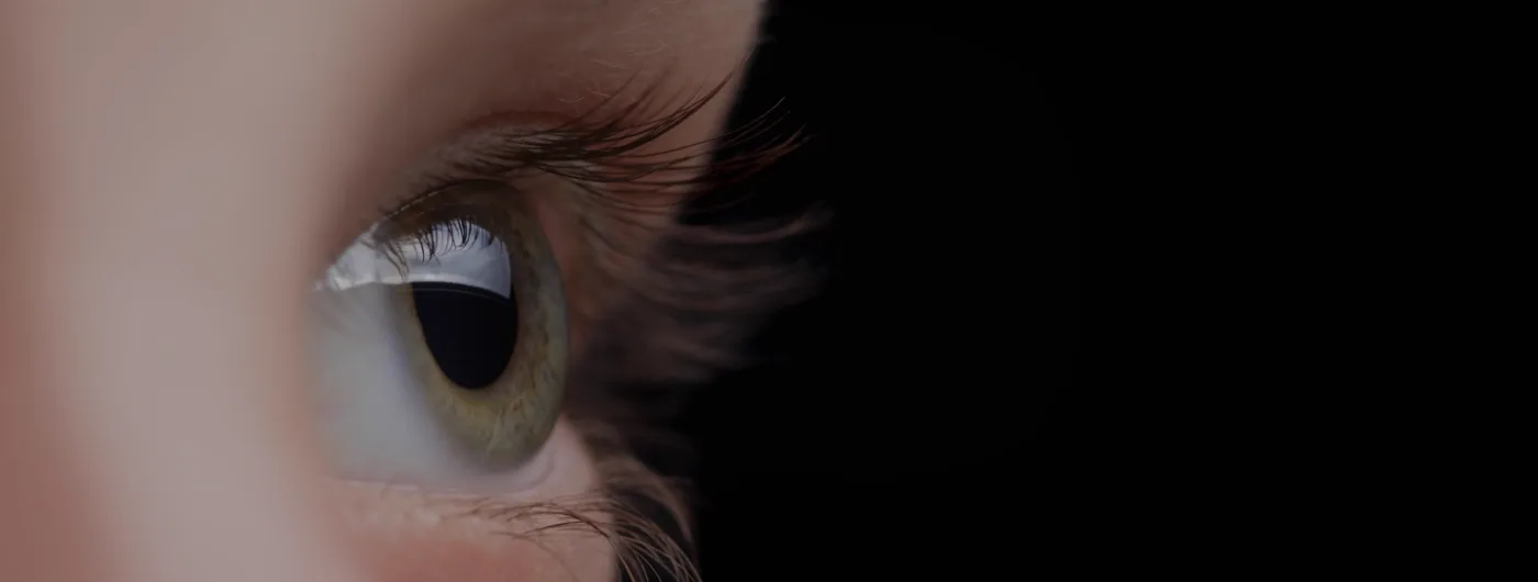 Close-up profile of an eye looking ahead