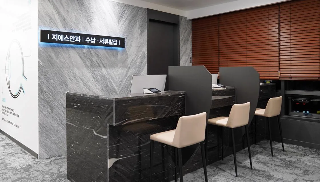 8F payment and document desk with stone counters and seated service stations